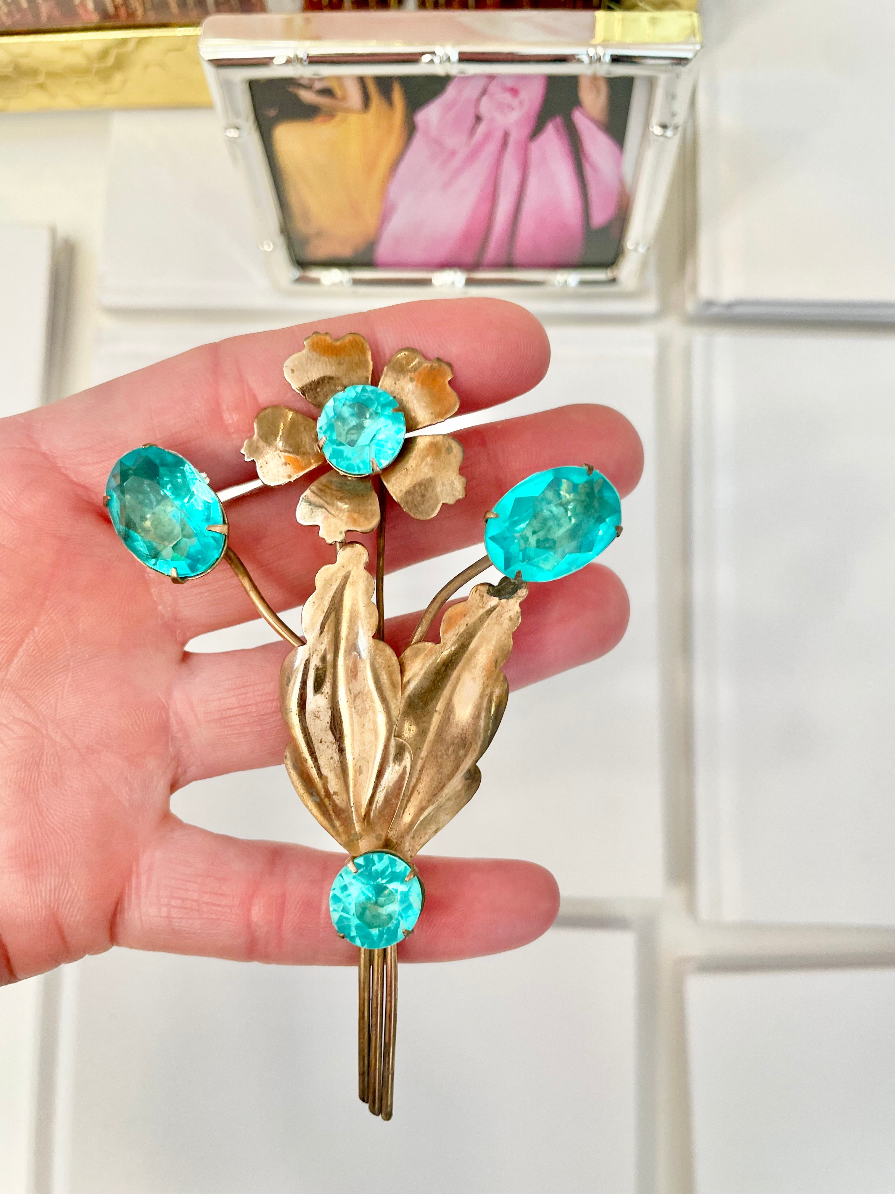 The happiest hostess is a lover of the most colorful jewels... this brooch is divine!