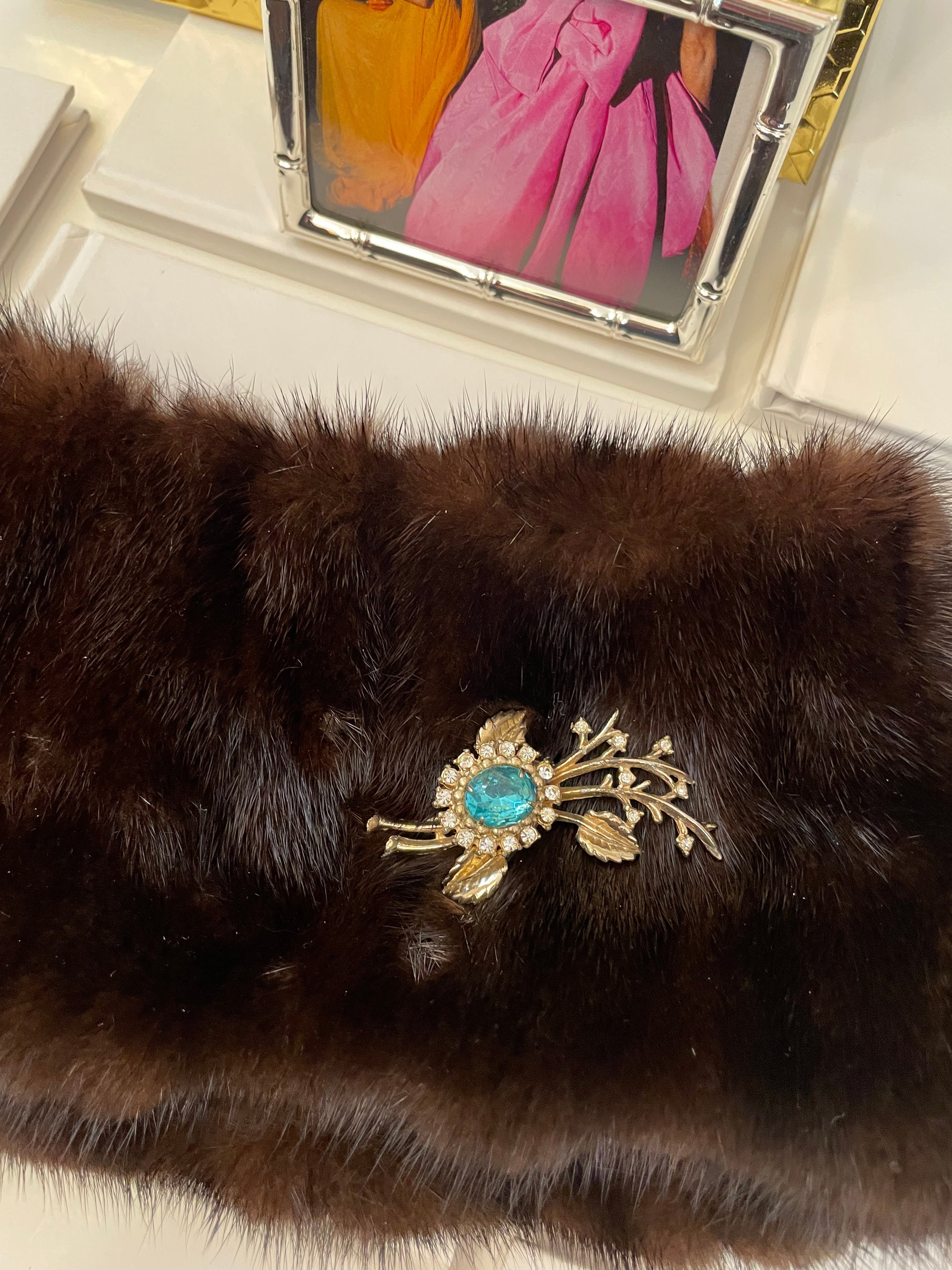 The happy hostess loves a colorful brooch... oh so divine!