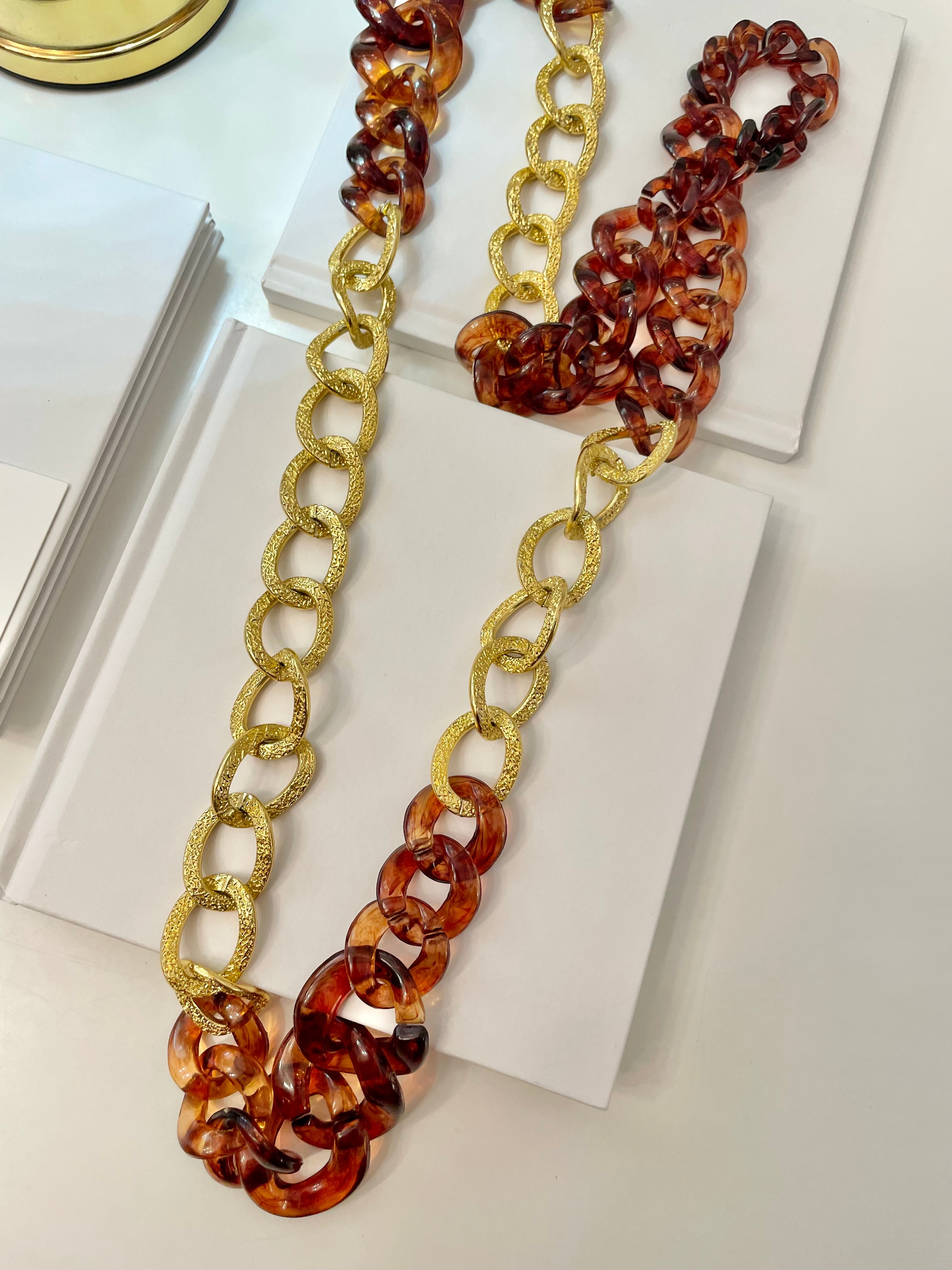 The Socialite and her love of gold chains.. this one is extra special with the tortoise acrylic chains.. So elegant.