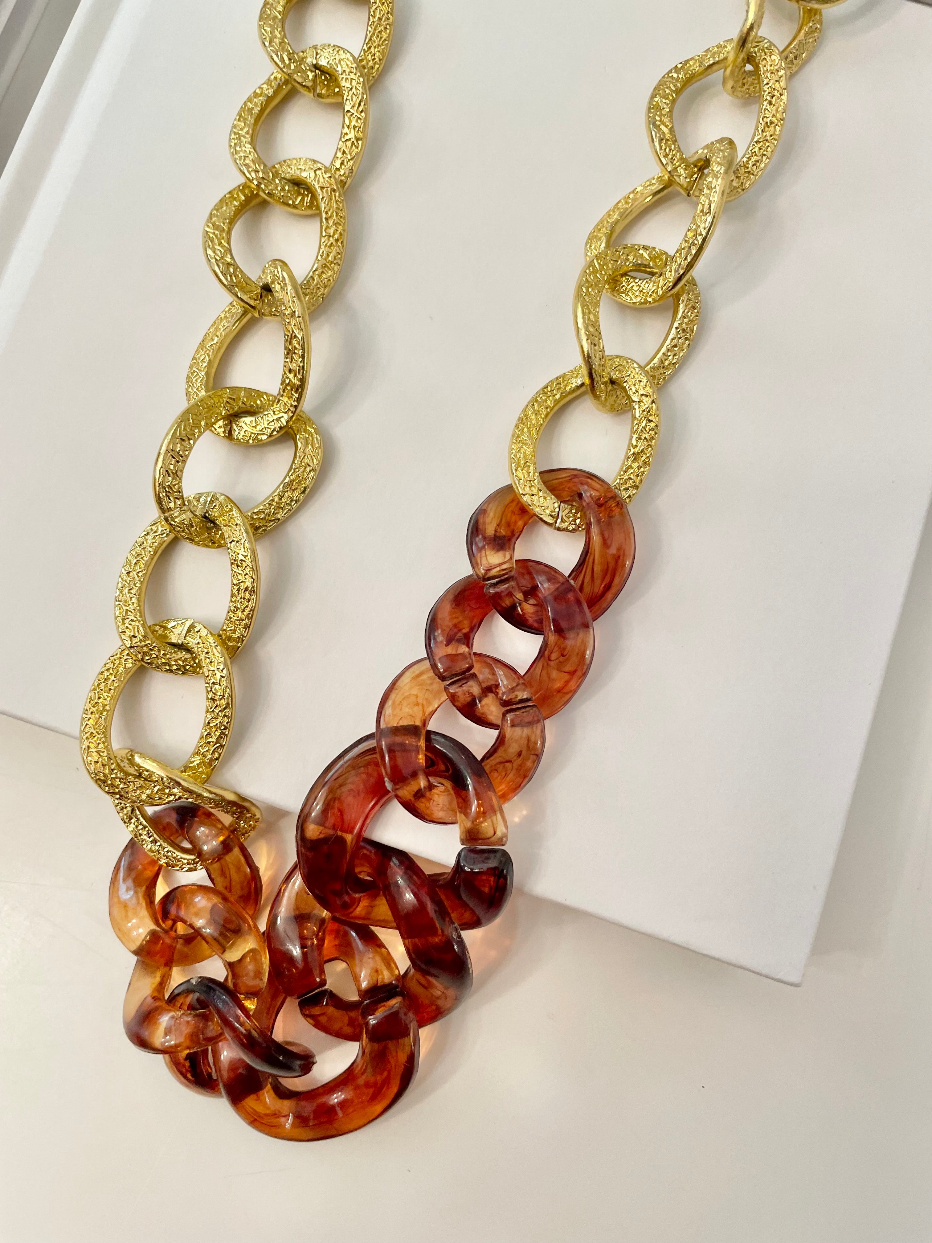 The Socialite and her love of gold chains.. this one is extra special with the tortoise acrylic chains.. So elegant.