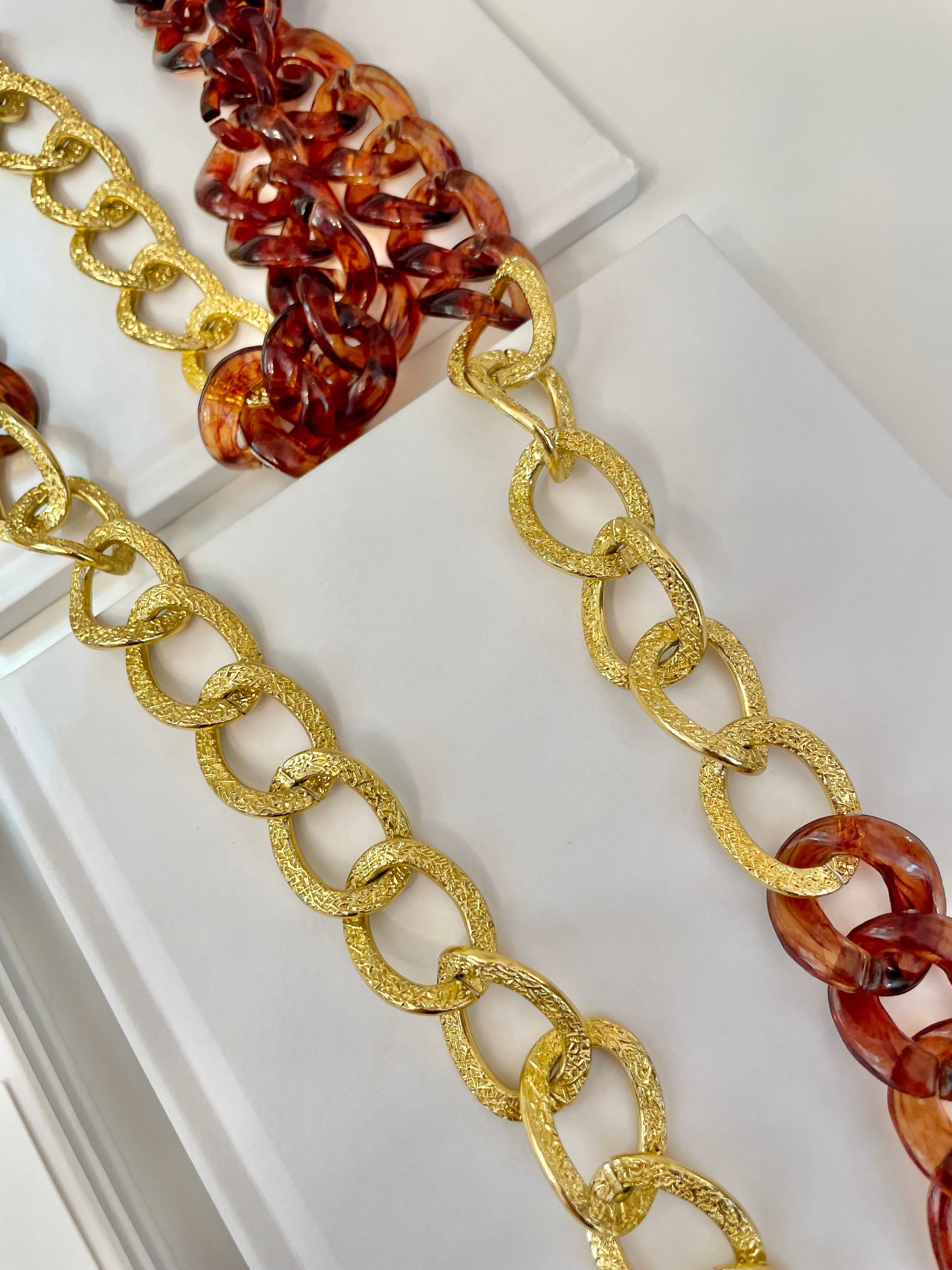 The Socialite and her love of gold chains.. this one is extra special with the tortoise acrylic chains.. So elegant.