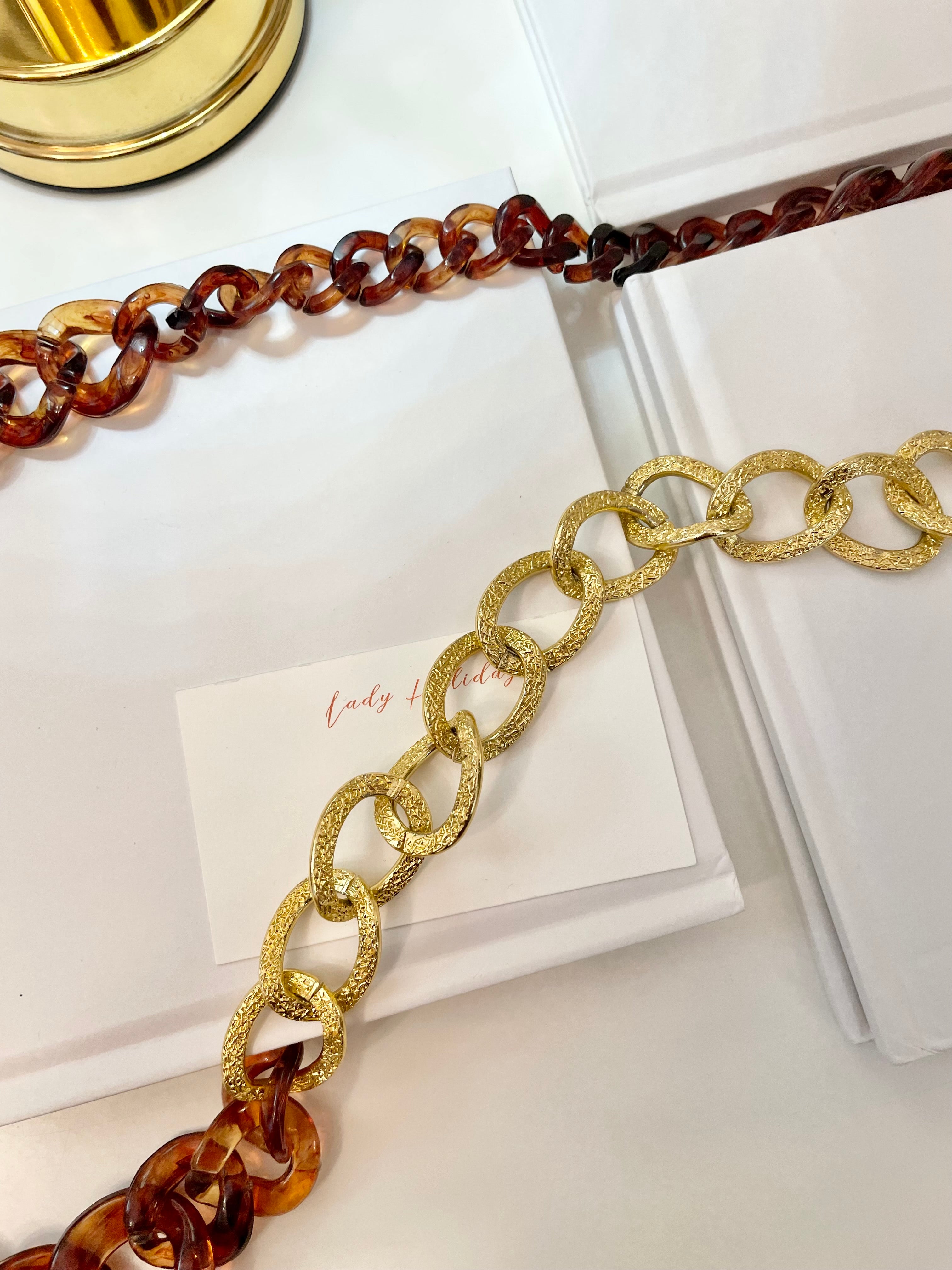 The Socialite and her love of gold chains.. this one is extra special with the tortoise acrylic chains.. So elegant.